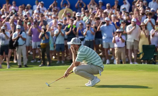 Alex Fitzpatrick, of England, reacts after sinking a birdie putt and winning the tournament with his brother Matt Fitzpatrick during the final round of the PGA Zurich Classic of New Orleans golf tournament, Sunday, April 26, 2026, in Avondale, La. (AP Photo/Matthew Hinton)