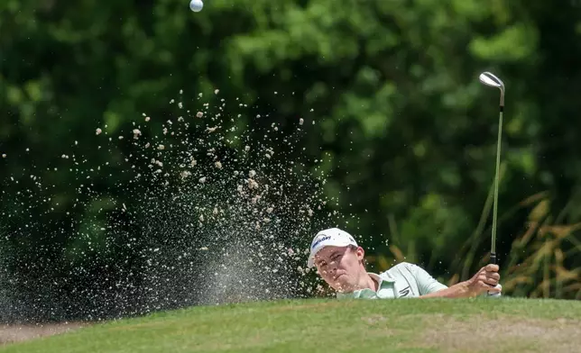 Matt Fitzpatrick, of England, hits from a bunker on the second hole during the final round of the PGA Zurich Classic of New Orleans golf tournament, Sunday, April 26, 2026, in Avondale, La. (AP Photo/Matthew Hinton)