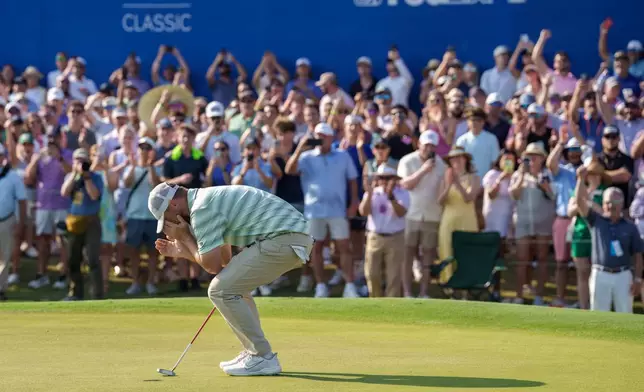 Alex Fitzpatrick, of England, reacts after sinking a birdie putt and winning the tournament with his brother Matt Fitzpatrick during the final round of the PGA Zurich Classic of New Orleans golf tournament, Sunday, April 26, 2026, in Avondale, La. (AP Photo/Matthew Hinton)