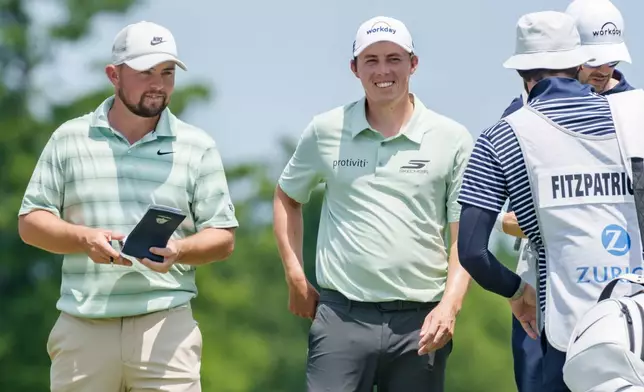 Brothers Alex, left, and Matt Fitzpatrick, second from left, of England, smile on the second hole during the final round of the PGA Zurich Classic of New Orleans golf tournament, Sunday, April 26, 2026, in Avondale, La. (AP Photo/Matthew Hinton)
