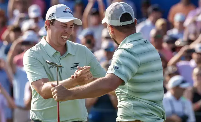Alex Fitzpatrick, right, of England, reacts after sinking a birdie putt and winning the tournament with his brother Matt Fitzpatrick, left, during the final round of the PGA Zurich Classic of New Orleans golf tournament, Sunday, April 26, 2026, in Avondale, La. (AP Photo/Matthew Hinton)
