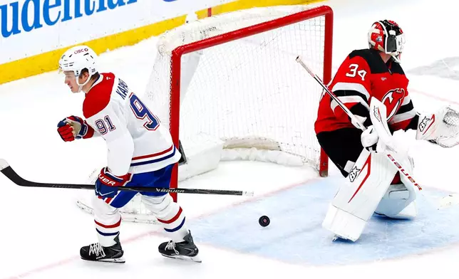 Montréal Canadiens center Oliver Kapanen (91) reacts after scoring against New Jersey Devils goaltender Jake Allen (34) during shootout in an NHL hockey game, Saturday, April 4, 2026, in Newark, N.J. (AP Photo/Noah K. Murray)