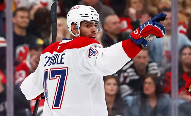 Montréal Canadiens defenseman Jayden Struble reacts after scoring against the New Jersey Devils during the first period of an NHL hockey game, Saturday, April 4, 2026, in Newark, N.J. (AP Photo/Noah K. Murray)