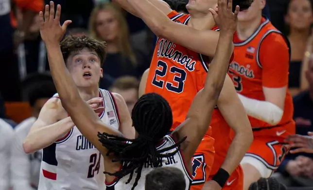 Illinois guard Keaton Wagler (23) drives against UConn during the second half of an NCAA college basketball tournament semifinal game at the Final Four, Saturday, April 4, 2026, in Indianapolis. (AP Photo/AJ Mast)