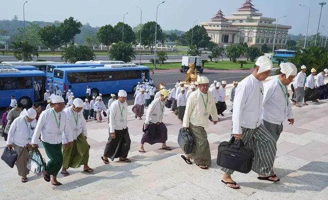 Myanmar lawmakers arrive to attend a session at Union Parliament in Naypyitaw, Myanmar, Thursday, April 9, 2026. (AP Photo/Aung Shine Oo)