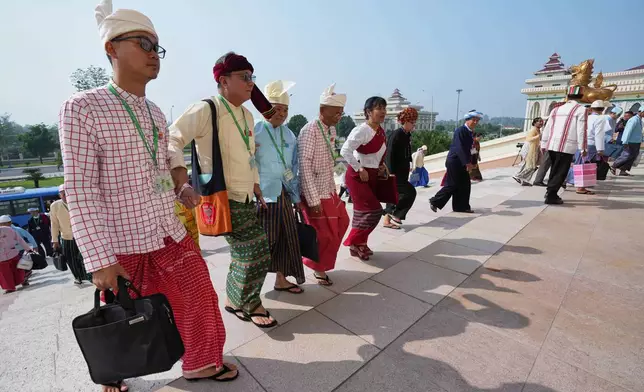 Ethnic lawmakers arrive to attend a session at Union Parliament in Naypyitaw, Myanmar, Thursday, April 9, 2026. (AP Photo/Aung Shine Oo)