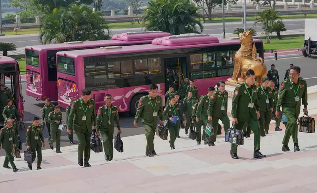Myanmar's military representatives arrive to attend a session at Union Parliament in Naypyitaw, Myanmar, Thursday, April 9, 2026. (AP Photo/Aung Shine Oo)