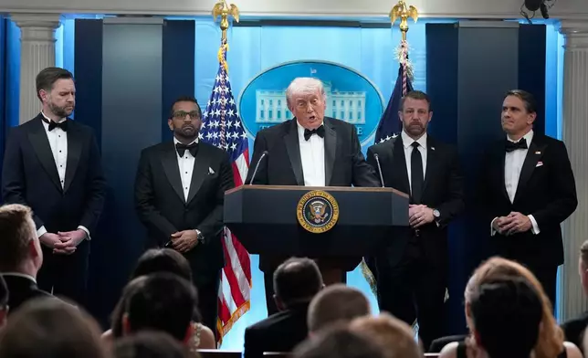 President Donald Trump speaks in the James Brady Press Briefing Room at the White House after an unspecified threat at the annual White House Correspondents' Association Dinner in Washington, Saturday, April 25, 2026, as Vice President JD Vance, FBI director Kash Patel, Homeland Security Secretary Markwayne Mullin and acting Attorney General Todd Blanche listen. (AP Photo/Jose Luis Magana)