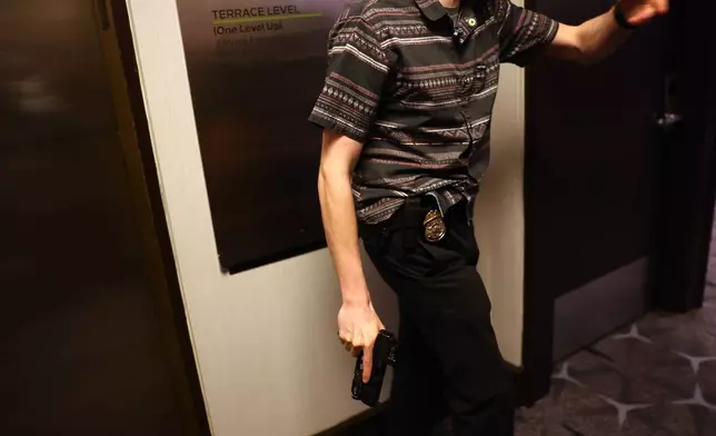 Law enforcement responds during an incident at the White House Correspondents Dinner, Saturday, April 25, 2026, in Washington. (AP Photo/Tom Brenner)