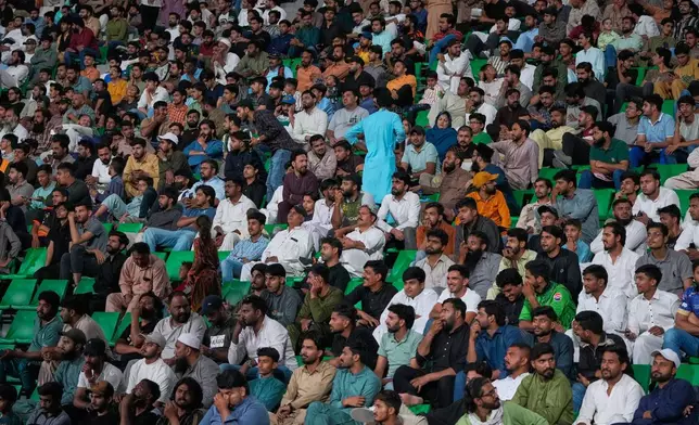 Fans cheer the Pakistan Super League first eliminator cricket match between Multan Sultans and Hyderabad Kingsmen at the Gaddafi Stadium in Lahore, Pakistan, Wednesday, April 29, 2026. (AP Photo/K.M. Chaudary)