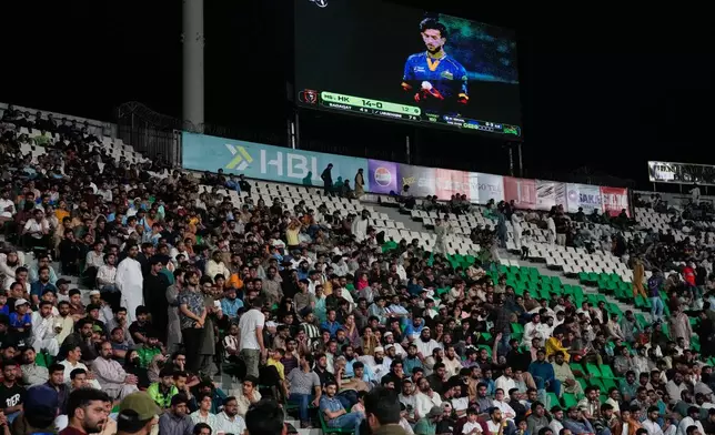 Fans cheer the Pakistan Super League first eliminator cricket match between Multan Sultans and Hyderabad Kingsmen at the Gaddafi Stadium in Lahore, Pakistan, Wednesday, April 29, 2026. (AP Photo/K.M. Chaudary)