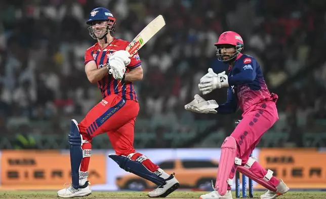 Lucknow Super Giants' Mitchell Marsh plays a shot during the Indian Premier League cricket match between Lucknow Super Giants and Rajasthan Royals in Lucknow, India, Wednesday, April 22, 2026. (AP Photo)