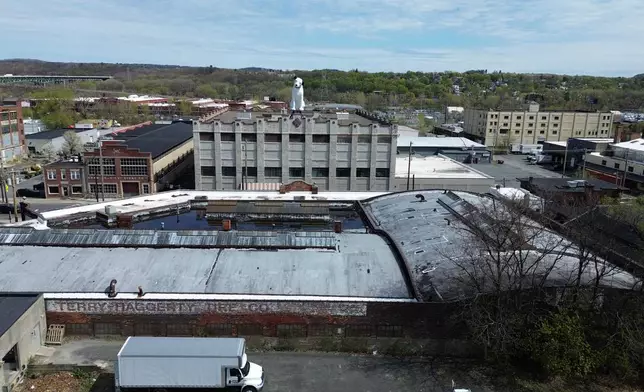 A giant statue of Nipper the dog sits atop a building in the warehouse district in Albany, N.Y., Tuesday, April 21, 2026. (AP Photo/Ted Shaffrey)