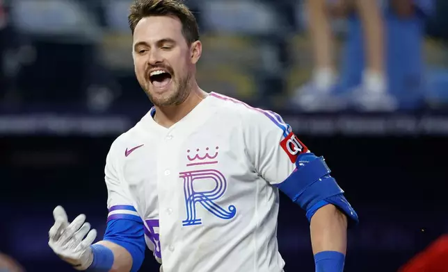 Kansas City Royals' Lane Thomas celebrates after hitting a walkoff home run during a baseball game against the Los Angeles Angels in Kansas City, Mo., Sunday, April 26, 2026. (AP Photo/Colin E. Braley)