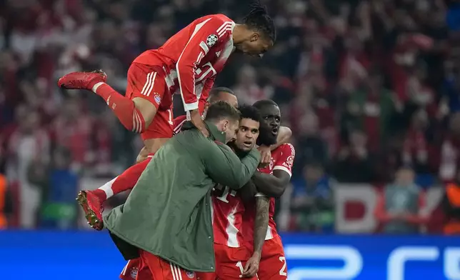 Bayern's Luis Diaz, center, celebrates with his teammates after scoring his side's third goal during the Champions League quarterfinal second leg soccer match between Bayern Munich and Real Madrid in Munich, Germany, Wednesday, April 15, 2026. (AP Photo/Matthias Schrader)