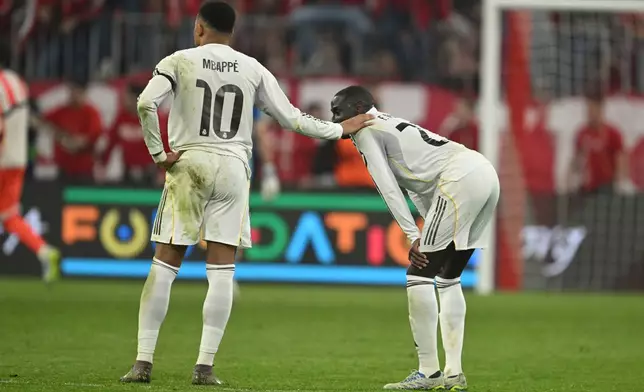 Real Madrid's Kylian Mbappe reacts at the end of the Champions League quarterfinal second leg soccer match between Bayern Munich and Real Madrid in Munich, Germany, Wednesday, April 15, 2026. (AP Photo/Lennart Preiss)