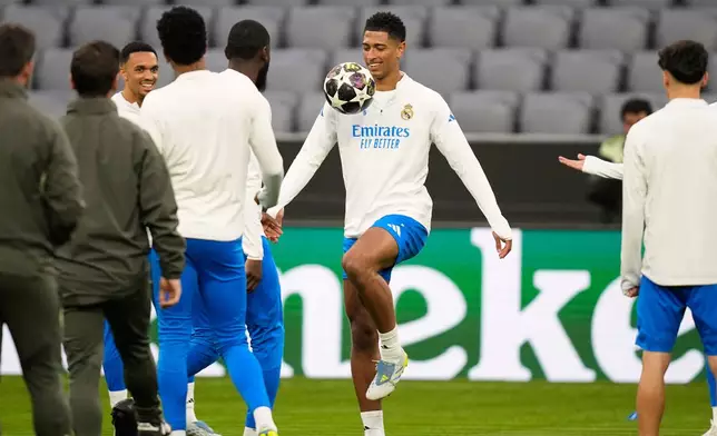 Real Madrid's Jude Bellingham exercises during a training session ahead of the Champions League quarterfinal second leg soccer match between Bayern Munich and Real Madrid in Munich, Germany, Tuesday, April 14, 2026. (AP Photo/Matthias Schrader)