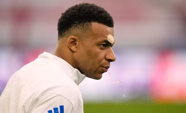 Real Madrid's Kylian Mbappe reacts during a training session ahead of the Champions League quarterfinal second leg soccer match between Bayern Munich and Real Madrid in Munich, Germany, Tuesday, April 14, 2026. (AP Photo/Matthias Schrader)