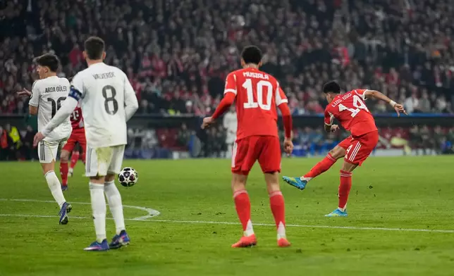 Bayern's Luis Diaz, right, scores his side's third goal during the Champions League quarterfinal second leg soccer match between Bayern Munich and Real Madrid in Munich, Germany, Wednesday, April 15, 2026. (AP Photo/Matthias Schrader)
