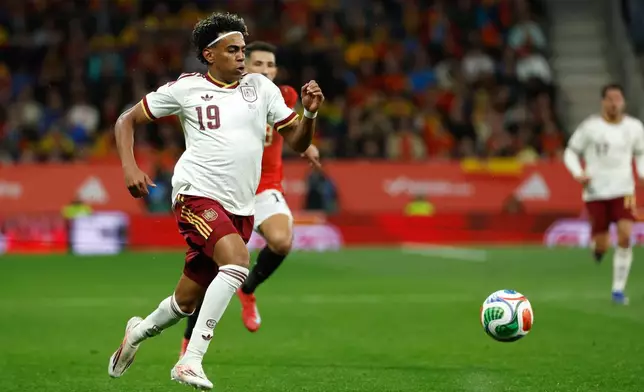 Spain's Lamine Yamal controls the ball during the international friendly soccer match between Spain and Egypt in Barcelona, Spain, Tuesday, March 31, 2026. (AP Photo/Joan Monfort)