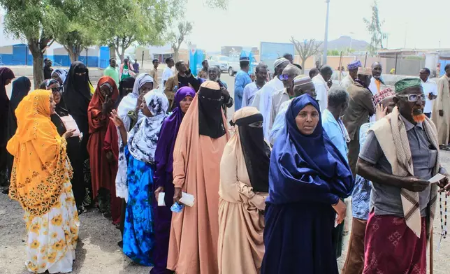 People line up to vote at a polling station during the 2026 Djibouti presidential election, in Mouloud, Djibouti, Friday, April 10, 2026. (AP Photo/Guirreh Moumin)