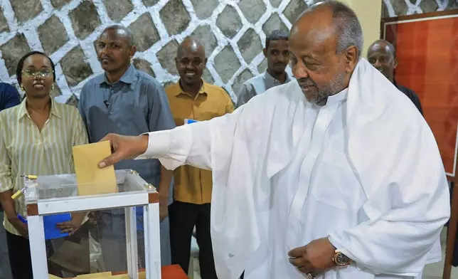 Djibouti's incumbent President Ismail Omar Guelleh casts his vote at the City Hall polling station during the presidential election in Mouloud, Djibouti, Friday, April 10, 2026. (AP Photo/Guirreh Moumin)
