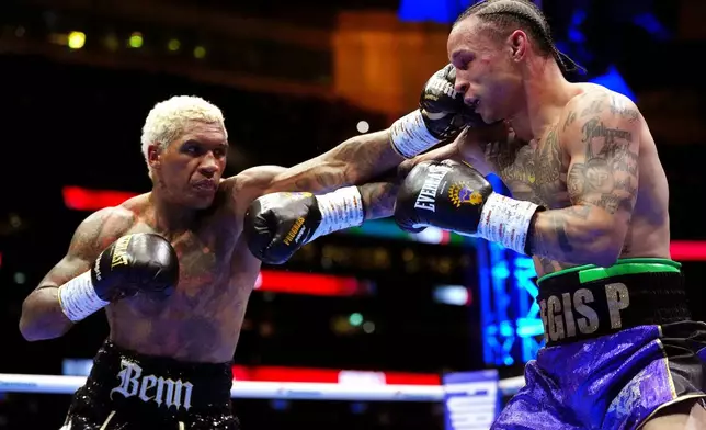 Boxers Conor Benn, left, and Regis Prograis battle during a welterweight bout at Tottenham Hotspur Stadium in London, Saturday, April 11, 2026. (Bradley Collyer/PA via AP)