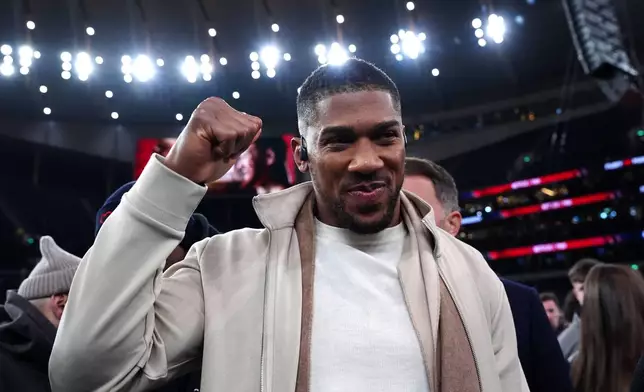 Boxer Anthony Joshua reacts following the heavyweight bout between Tyson Fury and Arslanbek Makhmudov in London, Saturday, April 11, 2026. (Bradley Collyer/PA via AP)