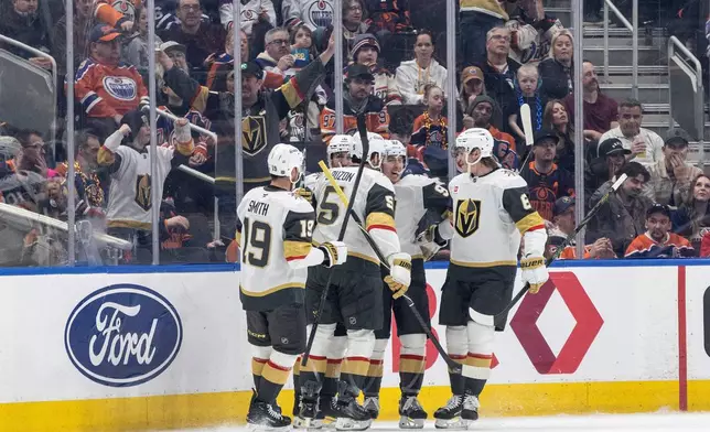 Vegas Golden Knights players celebrate a goal against the Edmonton Oilers during the second period of an NHL hockey game in Edmonton, Alberta, on Saturday April 4, 2026. (Jason Franson/The Canadian Press via AP)