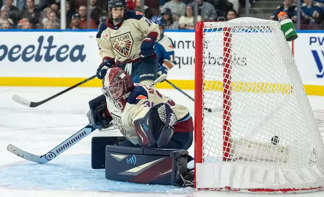 Vancouver Goldeneyes' Claire Thompson, not seen, scores on Montreal Victoire goaltender Sandra Abstreiter (30) during the third period of a PWHL hockey game, in Vancouver, on Tuesday, April 21, 2026. (Ethan Cairns/The Canadian Press via AP)