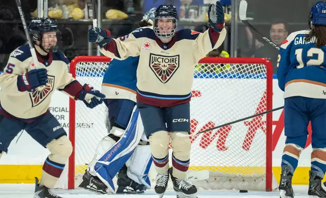 Montreal Victoire's Hayley Scamurra (16) celebrates her goal against the Vancouver Goldeneyes during the third period of a PWHL hockey game, in Vancouver, on Tuesday, April 21, 2026. (Ethan Cairns/The Canadian Press via AP)