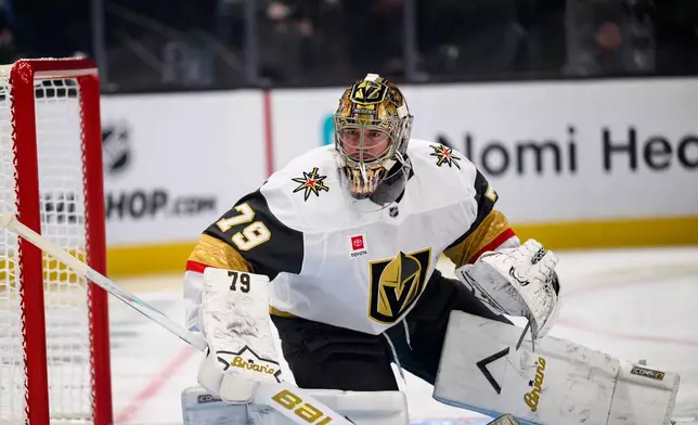 Vegas Golden Knights goaltender Carter Hart protects the net during the first period of Game 4 of a first-round NHL hockey Stanley Cup playoff series against the Utah Mammoth, Monday, April 27, 2026, in Salt Lake City. (AP Photo/Tyler Tate)