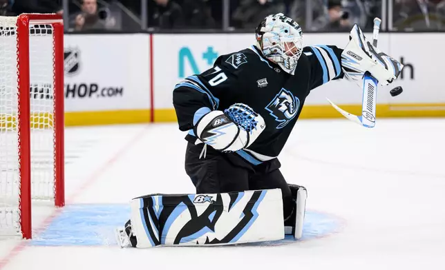 Utah Mammoth goaltender Karel Vejmelka blocks the puck with his stick during the second period of Game 4 of a first-round NHL hockey Stanley Cup playoff series against the Vegas Golden Knights, Monday, April 27, 2026, in Salt Lake City. (AP Photo/Tyler Tate)