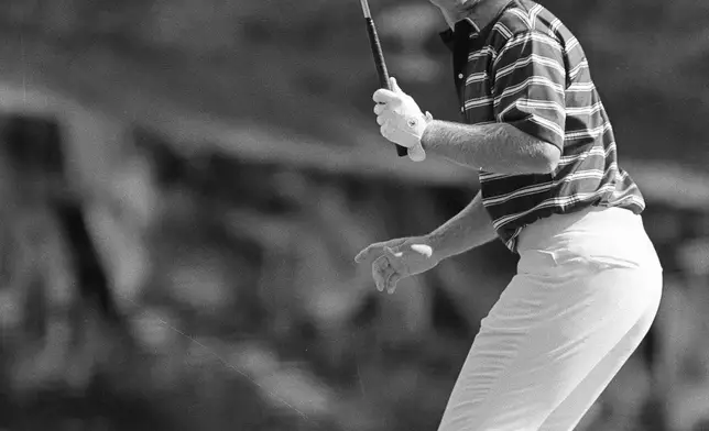 FILE - Jack Nicklaus as he makes a birdie putt on the 16th, on April 13, 1975 at Augusta, Ga. (AP Photo, File)