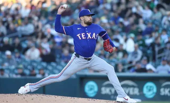 Texas Rangers pitcher Nathan Eovaldi throws to an Athletics batter during the first inning of a baseball game Monday, April 13, 2026, in West Sacramento, Calif. (AP Photo/Scott Marshall)