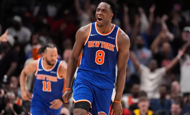 New York Knicks forward Og Anunoby (8) reacts after scoring during the first half of Game 4 in a first-round NBA playoffs basketball series against the Atlanta Hawks Saturday, April 25, 2026, in Atlanta. (AP Photo/Brynn Anderson)