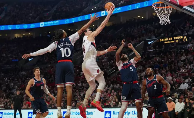 Portland Trail Blazers forward Deni Avdija (8) goes to the basket during the first half of an NBA basketball game against the Los Angeles Clippers, Friday, April 10, 2026, in Portland, Ore. (AP Photo/Jenny Kane)