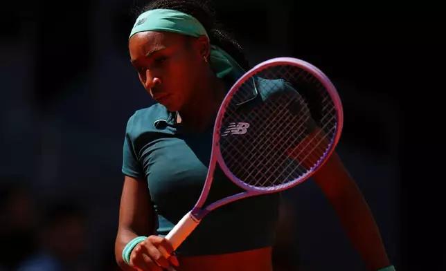 Coco Gauff of the U.S. reacts during her match against Sorana Cirstea of Romania during the Madrid Open tennis tournament in Madrid, Sunday, April 26, 2026. (AP Photo/Manu Fernandez)