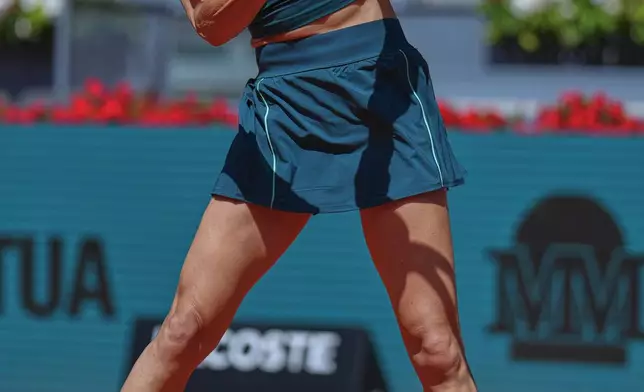Sorana Cirstea of Romania returns the ball to Coco Gauff of the U.S. during the Madrid Open tennis tournament in Madrid, Sunday, April 26, 2026. (AP Photo/Manu Fernandez)