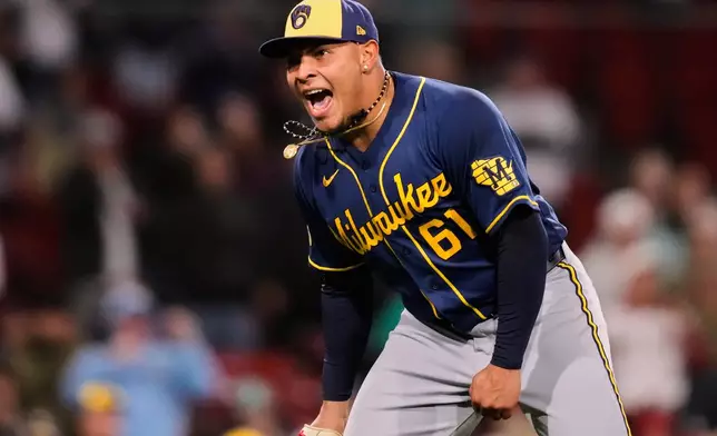 Milwaukee Brewers pitcher Angel Zerpa celebrates after his team defeated the Boston Red Sox in a baseball game at Fenway Park, Monday, April 6, 2026, in Boston. (AP Photo/Charles Krupa)