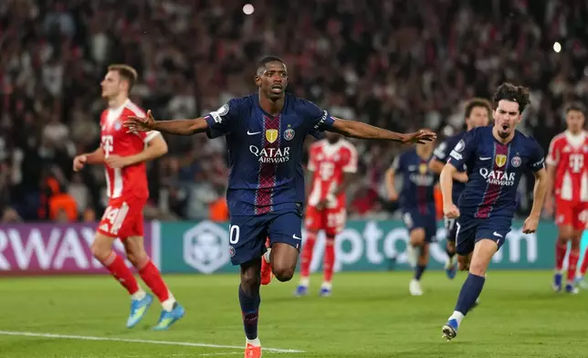 PSG's Ousmane Dembele celebrates after scoring his side's third goal during a Champions League semifinal, first leg, soccer match between Paris Saint-Germain and Bayern Munich in Paris, Tuesday, April 28, 2026. (AP Photo/Aurelien Morissard)