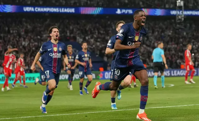 PSG's Ousmane Dembele celebrates after scoring his side's third goal during a Champions League semifinal, first leg, soccer match between Paris Saint-Germain and Bayern Munich in Paris, Tuesday, April 28, 2026. (AP Photo/Aurelien Morissard)