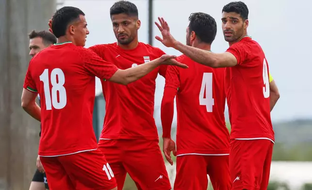 Iran's Mehdi Taremi, right, celebrates with teammates after scoring their side's second goal during a friendly soccer match between Iran and Costa Rica, in Antalya, southern Turkey, Tuesday, March 31, 2026. (AP Photo/Riza Ozel)