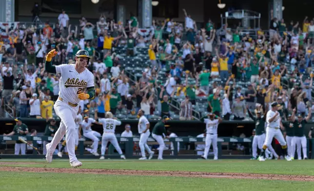 Athletics' Brent Rooker runs the bases after hitting a walk-off three-run home run during the 10th inning of a baseball game against the Houston Astros Sunday, April 5, 2026, in West Sacramento, Calif. (AP Photo/Sara Nevis)