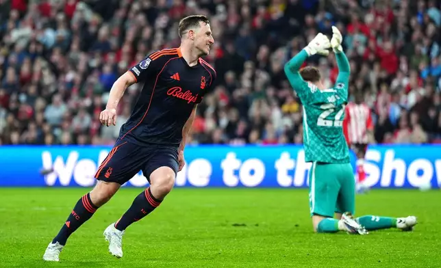 Nottingham Forest's Chris Wood, left, celebrates scoring their second goal during the Premier League soccer match between Sunderland and Nottingham Forest, Friday, April 24, 2026, in Sunderland, England. (Owen Humphreys/PA via AP)