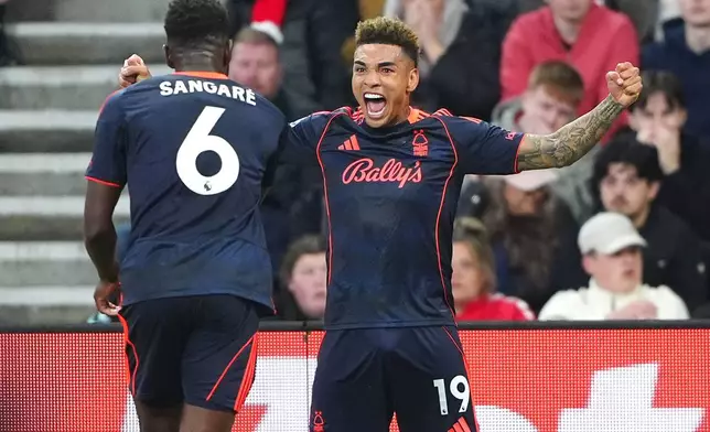Nottingham Forest's Igor Jesus, right, celebrates scoring their fourth goal of the game with teammate Ibrahim Sangare during the Premier League soccer match between Sunderland and Nottingham Forest, Friday, April 24, 2026, in Sunderland, England. (Owen Humphreys/PA via AP)