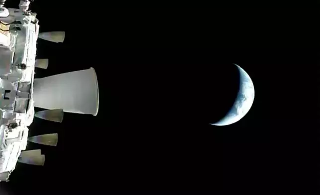 In this photo provided by NASA, a view of the Earth from NASA's Orion spacecraft as it orbits above the planet during the Artemis II test flight, on Thursday, April 2, 2026. (NASA via AP)