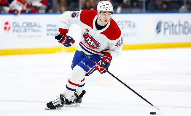 Montréal Canadiens defenseman Lane Hutson (48) skates with the puck during the first period of an NHL hockey game against the New York Islanders, Sunday, April 12, 2026, in Elmont, New York. (AP Photo/Noah K. Murray)