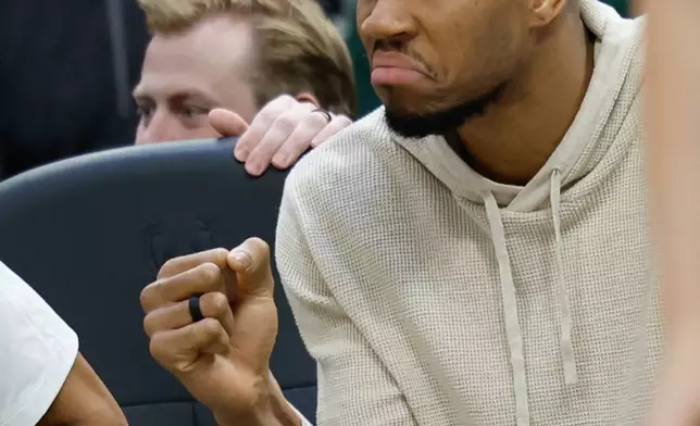 Milwaukee Bucks forward Giannis Antetokounmpo (34) reacts from the bench during the first half of an NBA basketball game against the Brooklyn Nets, Friday, April 10, 2026, in Milwaukee. (AP Photo/Jeffrey Phelps)
