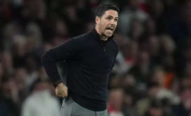 Arsenal's manager Mikel Arteta gives instructions during the UEFA Champions League second leg quarterfinal soccer match between Arsenal and Sporting in London, England, Wednesday, April 15, 2026. (AP Photo/Kin Cheung)